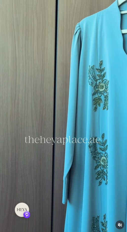 Aqua Grace Abaya in aqua blue with intricate botanical beadwork and an elegant flowing silhouette.