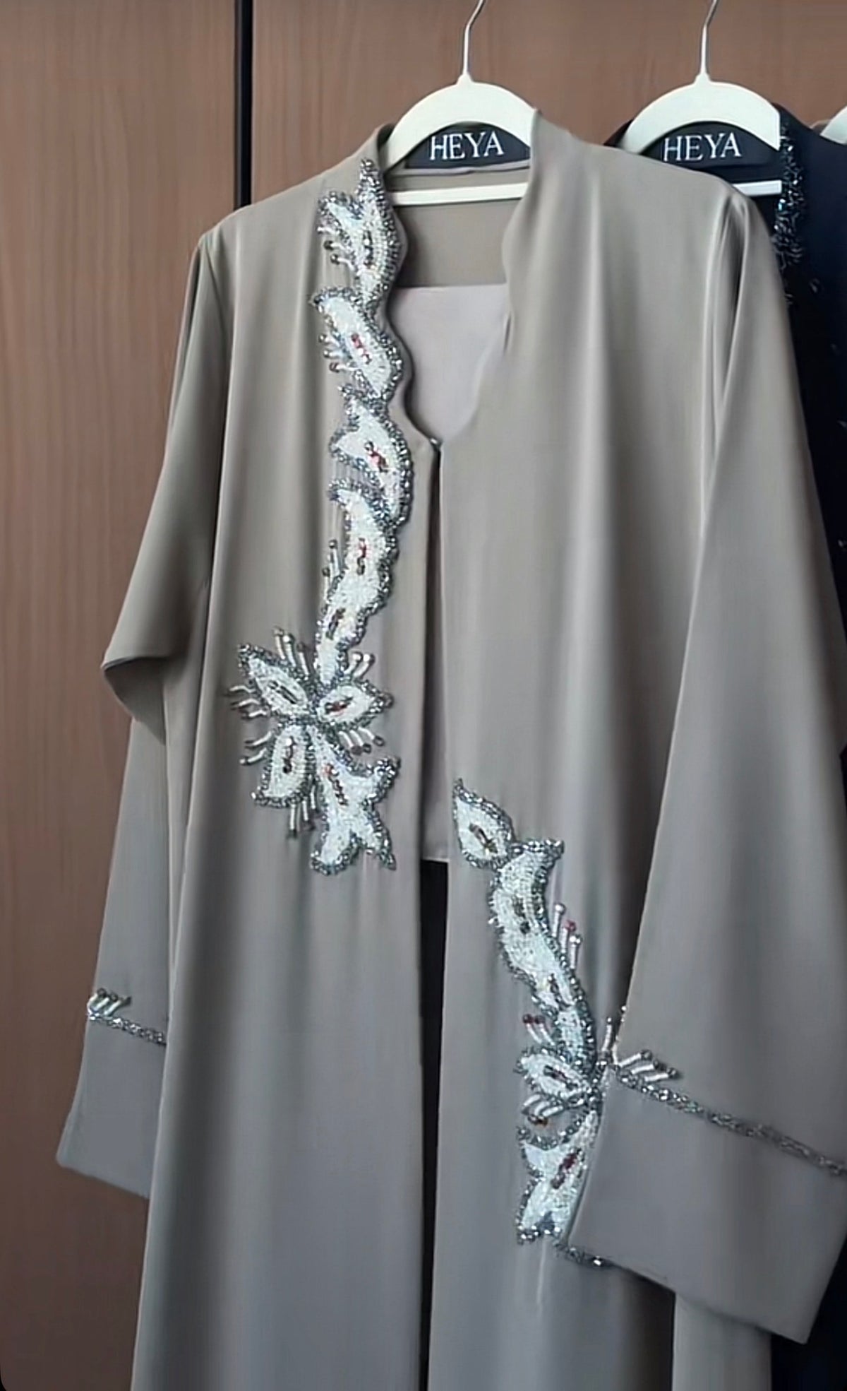 Model wearing the Pearl Grey Abaya featuring a graceful modest design in premium fabric.
