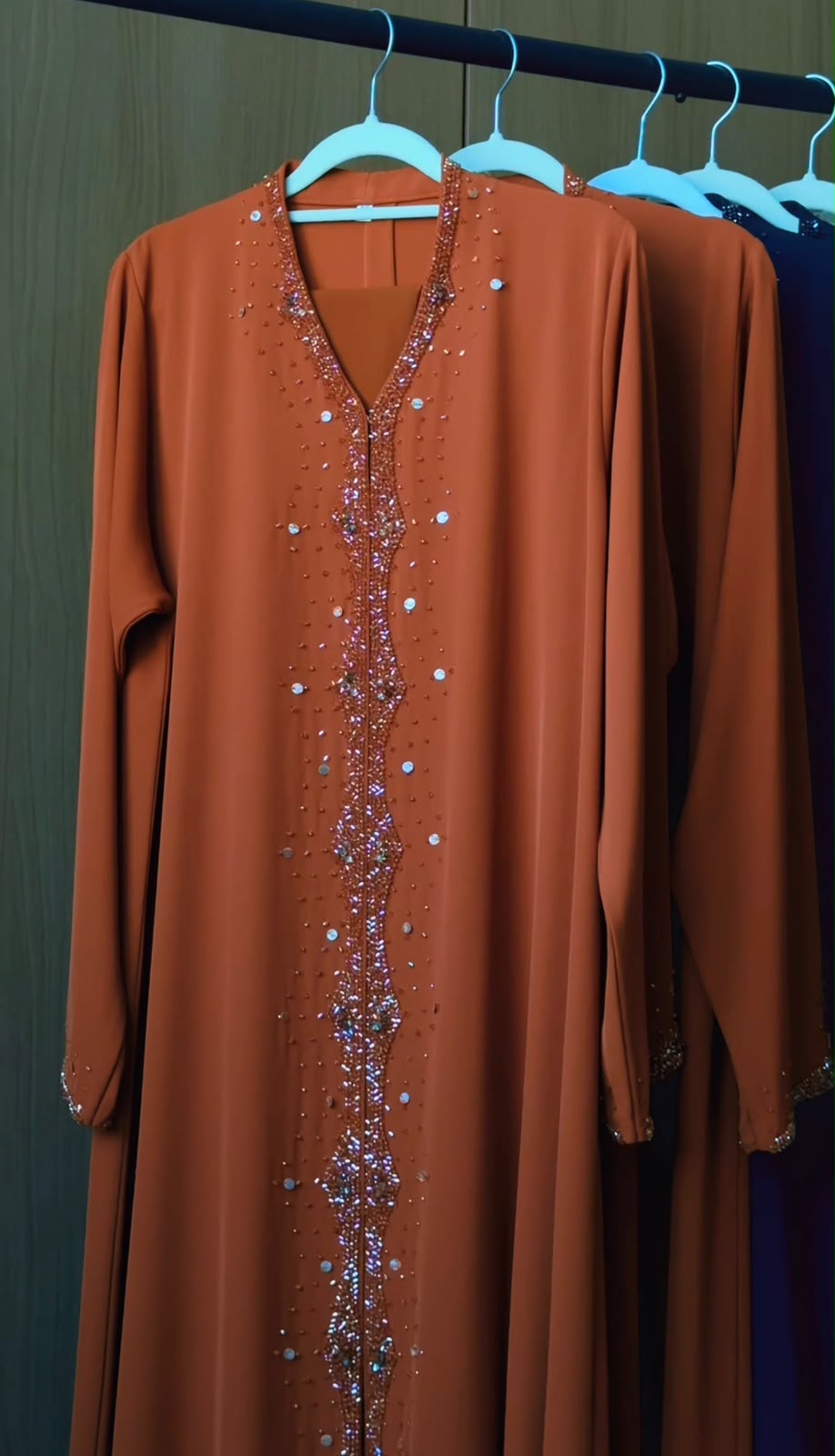 Amber Al Sahra copper abaya with crystal embellished neckline and front detailing