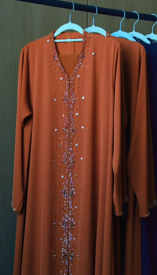 Amber Al Sahra copper abaya with crystal embellished neckline and front detailing