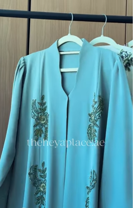 Aqua Grace Abaya in aqua blue with intricate botanical beadwork and an elegant flowing silhouette.