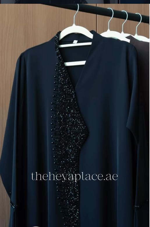 Black Diamond Abaya in jet black with intricate black crystal beadwork along the neckline and front opening.
