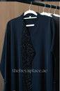 Black Diamond Abaya in jet black with intricate black crystal beadwork along the neckline and front opening.