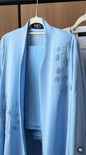 Blueberry Blossom Abaya in powder blue with cascading botanical beadwork and an elegant flowing silhouette.