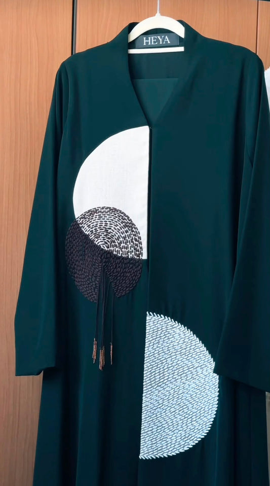 HEYA Elara Abaya in emerald green with black-and-white geometric embroidery and tassel detailing
