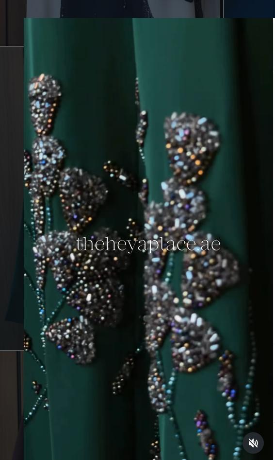 Emerald Noir Abaya in deep emerald green with shimmering floral beadwork and an elegant flowing silhouette.
