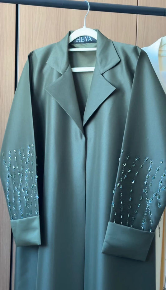 Majestic Forest Green Abaya with an elegant flowing design in premium modest fashion.