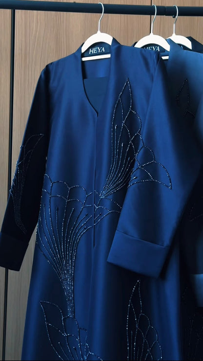 Rawdah royal blue abaya with floral-inspired crystal embellishments by HEYA