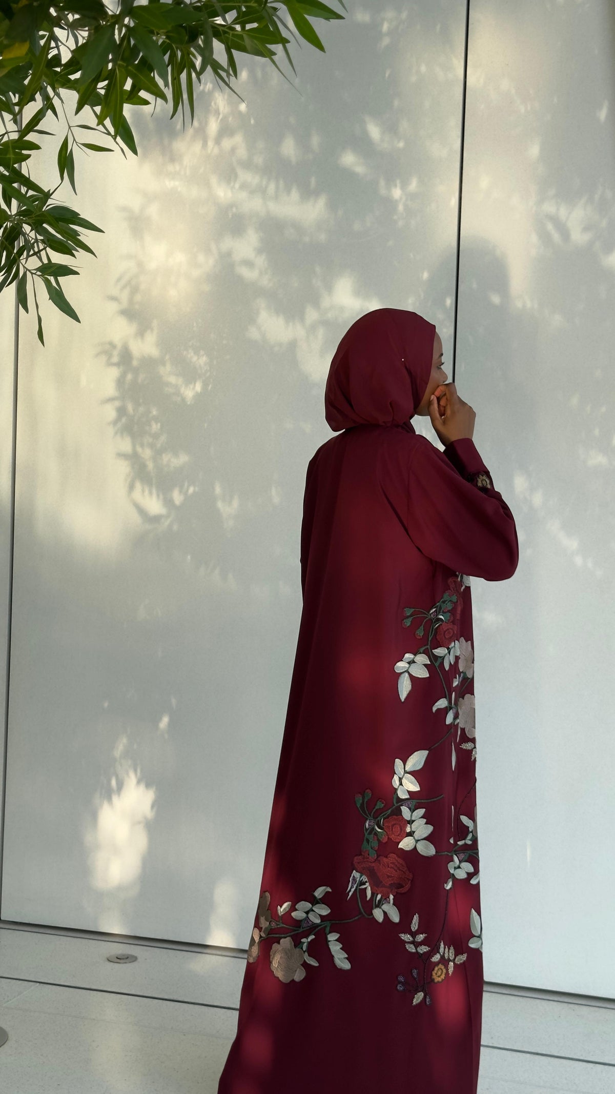 Roselle Maroon Floral Abaya by HEYA featuring elegant rose-inspired floral detailing and ivory blossoms.