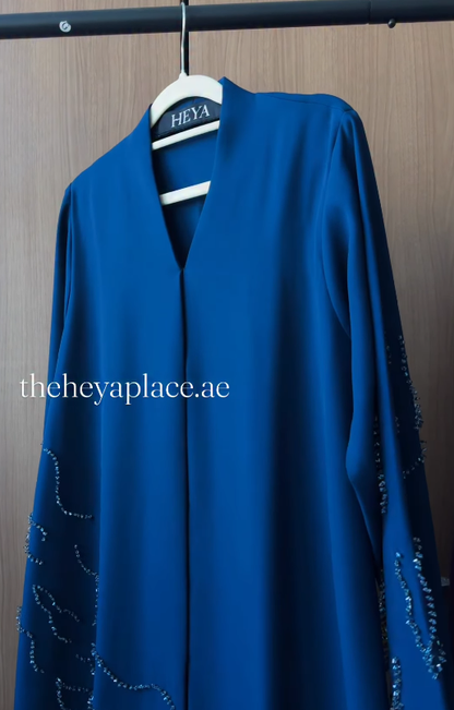 Royal Sapphire Abaya in deep royal blue with shimmering embellished sleeves and an elegant flowing silhouette.